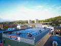 Roof of the frost river building with all of the solar panels and the duluth skyline in the background