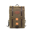 Front view of backpack fully packed to show expansion, and the two front leather lashing squares for additional leather straps to be added.