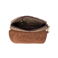 The inside of the bag includes a slip pocket and a hanging solid brass clip for keys.