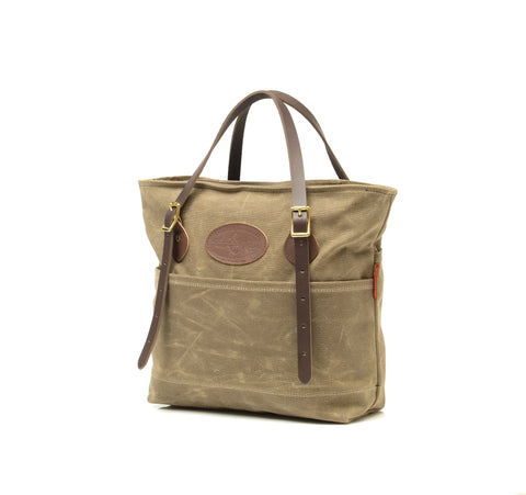 The bottom of the bag has a double layer of waxed canvas to keep contents dry and protect from abrasions when put on the ground.