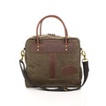 Great luggage tote made from durable waxed canvas, premium leather, and solid brass.