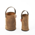 Handcrafted waxed canvas bucket that can be used to carry water to camp or any other item foraged from the woods.
