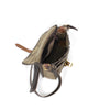 The inside of this shoulder bag has a hanging zippered pocket  and a large main compartment.
