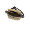 The interior has one nylon zippered sleeve and a main compartment. On the front is one sleeve and brass snap to secure the lid.