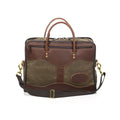 With high-end waxed canvas and premium leather this medium brief is durable and striking. Two leather handles on both sides for carrying and two heavy duty zippers on either side for storage. 