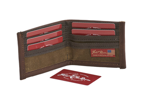 The inside has our signature top-end waxed canvas and strong webbed cotton. There are several standard card sized pockets on both sides and one large cavity for cash or extras.
