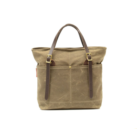 Made with waxed canvas, premium leather and solid brass.