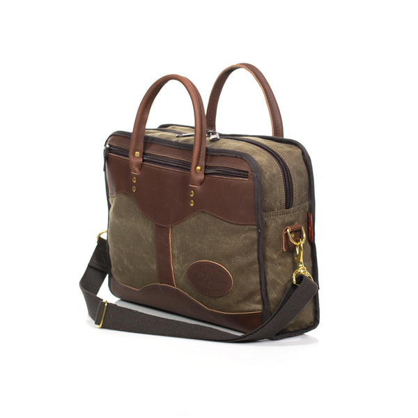 Handcrafted in the USA, this brief has been reinforced with solid brass rivets for durability. A strong webbed cotton shoulder strap makes sure you can go anywhere.