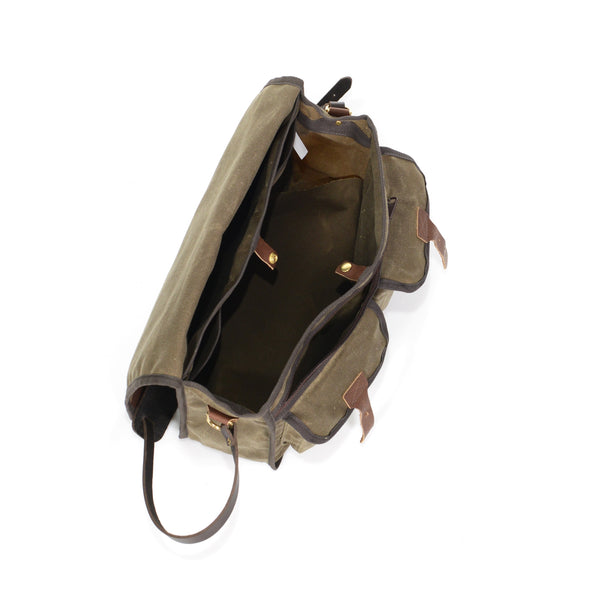 The interior has two slip sleeve pockets and a spacious main cavity. To secure your gear is a solid brass snap. 