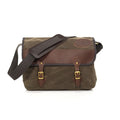 The Premium Carrier Brief Messenger Bag has a lid crafted with 50/50 high-end leather and waxed canvas. With the lid being secured with leather straps and solid brass buckles. A strong cotton webbed shoulder straps with a leather strap pad secured in place with two solid brass attachment points.