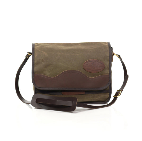 This small satchel is handcrafted out of high quality waxed canvas, premium leather, strong webbed cotton, and sold brass. 