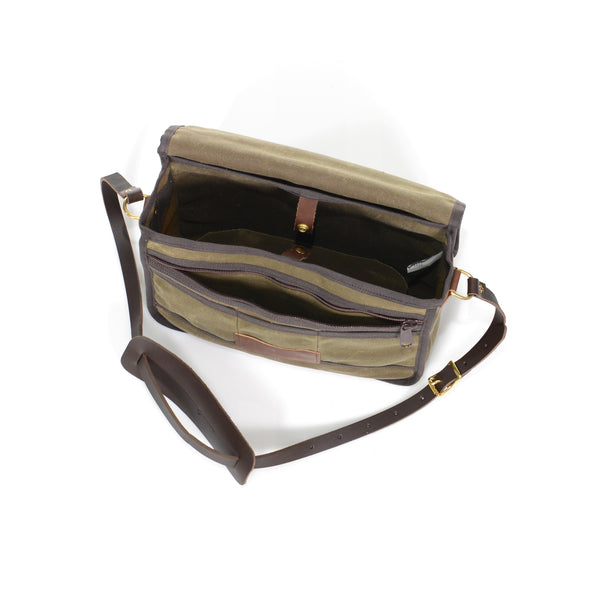 The front has one heavy duty nylon zipper pocket and several small pockets.