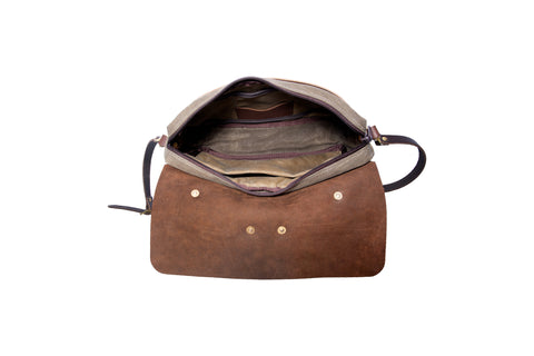 View of inside the zippered main compartment with multiple accessory internal pockets and lined inside seams.
