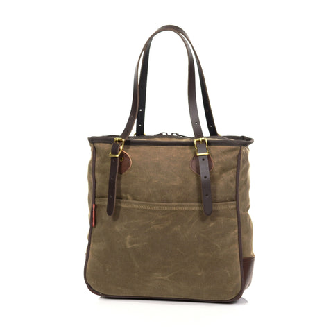 Back side of tote has a side slip pocket that is as wide as the entire bag.