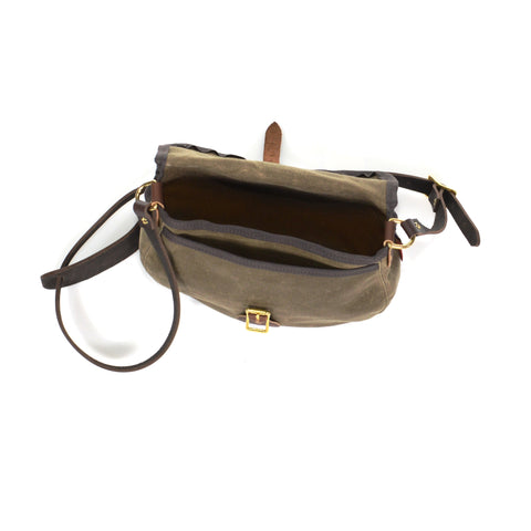 The inside of the bag has a large compartment and one slip pocket on the front of the bag.  Both areas are covered by the main flap.