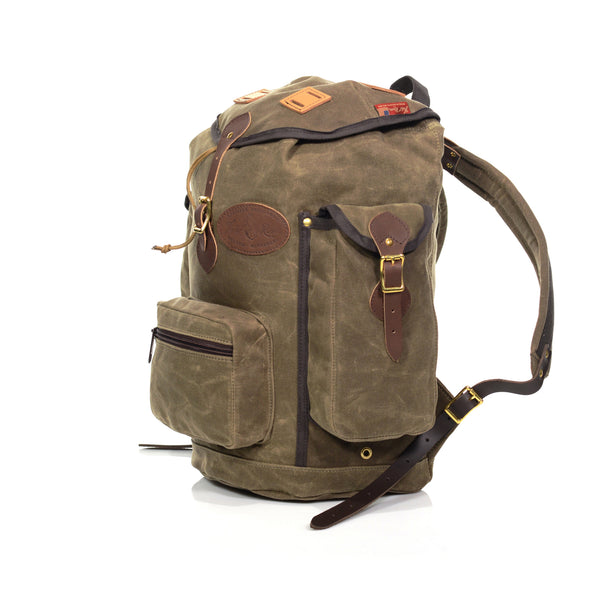 The side pockets on this backpack can hold water bottles and close with a quick flap and leather strap design.