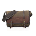 The Vintage Messenger Bag handcrafted out of premium leather, high quality waxed canvas, and sold brass. With two leather straps being secured down by two brass buckles. 
