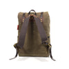 Back view of the backpack's shoulder straps made from durable cotton webbing, premium leather, and high quality brass buckles.