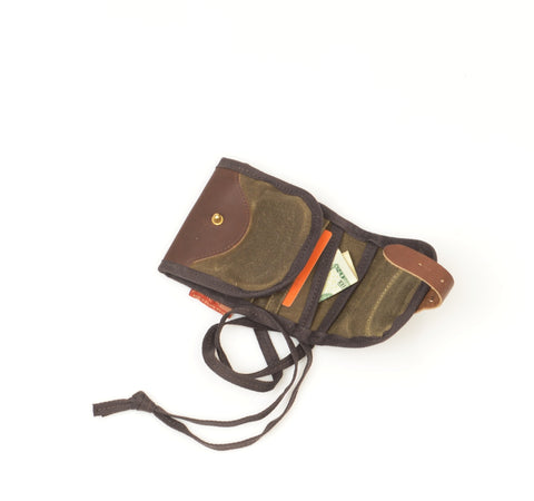 The wallet closes with a leather straps and solid brass post.