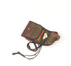 The wallet closes with a leather straps and solid brass post.
