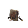 Waxed canvas and leather flap closure with a riveted leather strap and solid brass buckle.