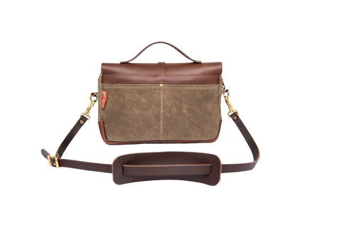 Premium leather shoulder strap and two slide pockets on the back of the bag.