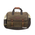 Handcrafted brief bag with heavy duty webbed cotton carrying straps with a leather handle for extra comfort.