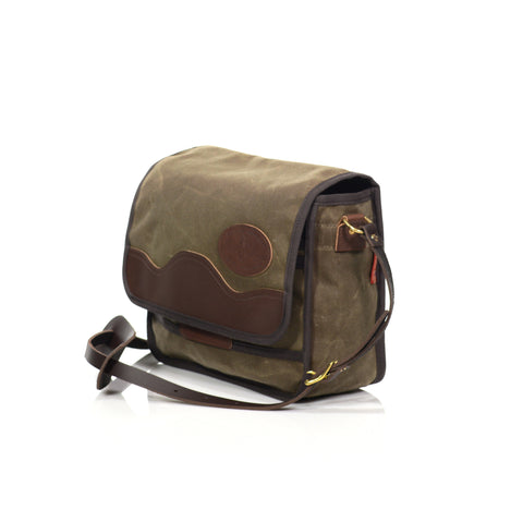 Equipped with a thin premium leather shoulder strap and pad. Secured in place with two solid brass attachment points.
