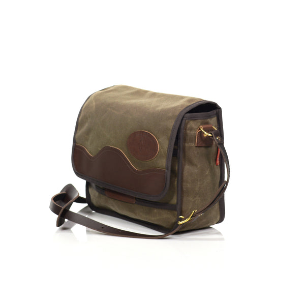 Equipped with a thin premium leather shoulder strap and pad. Secured in place with two solid brass attachment points.