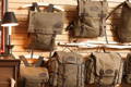 5 frost river packs hanging on a slat wooden wall
