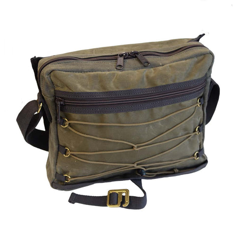 Heavy duty nylon zippers open the main compartment. On the front of the bag is another zippered pocket and laced paracord for additional storage.  