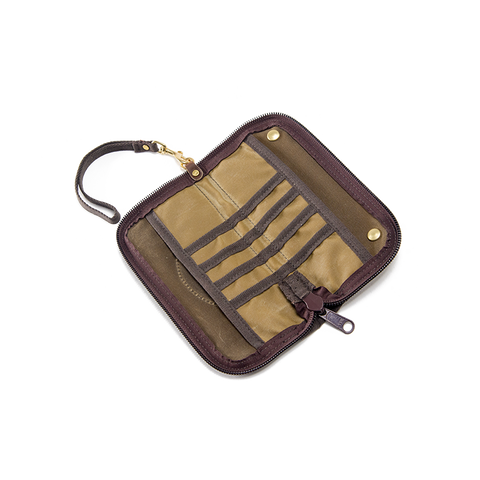 The interior having several small pockets down the middle and two slip sleeves on either side. 