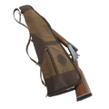 Beautiful case for a breakdown style gun, lined with sherpa, made with waxed canvas, premium leather, solid brass, and includes an exterior zippered pocket for additional storage.